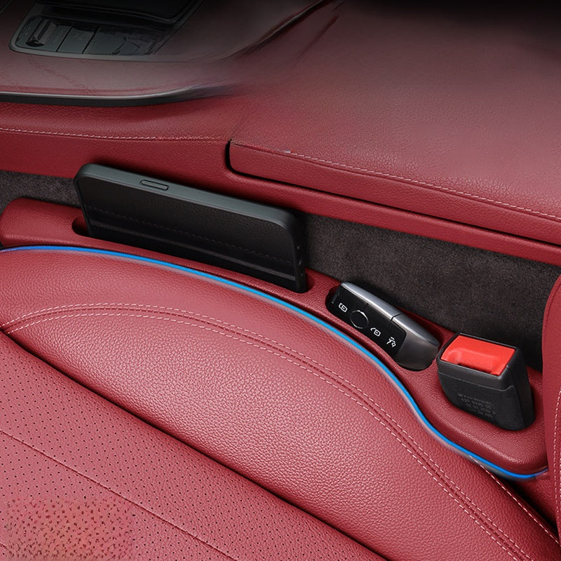 Seat gap filler strip